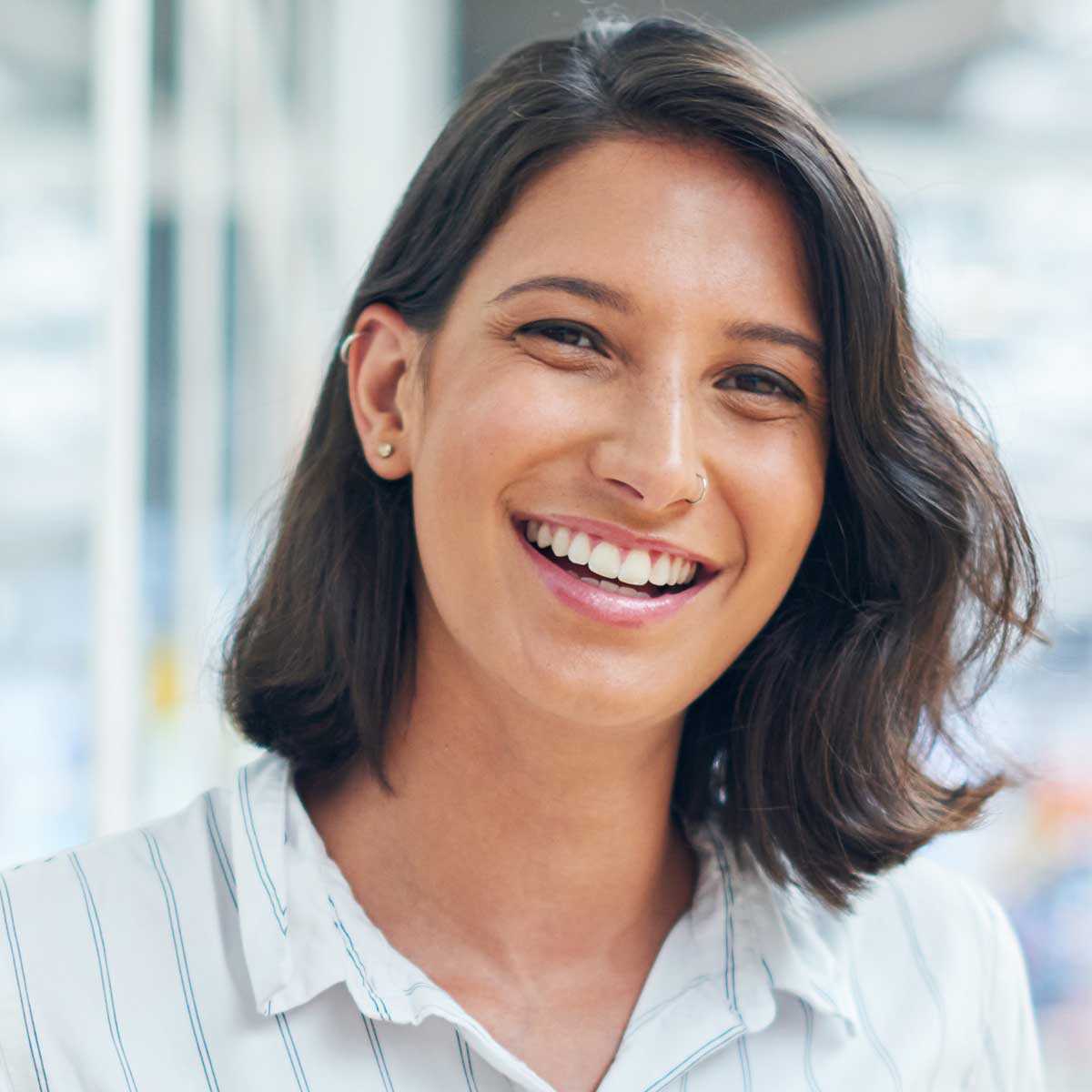 Shot-of-a-young-businesswoman-using-a-digital-tablet-in-a-modern-office